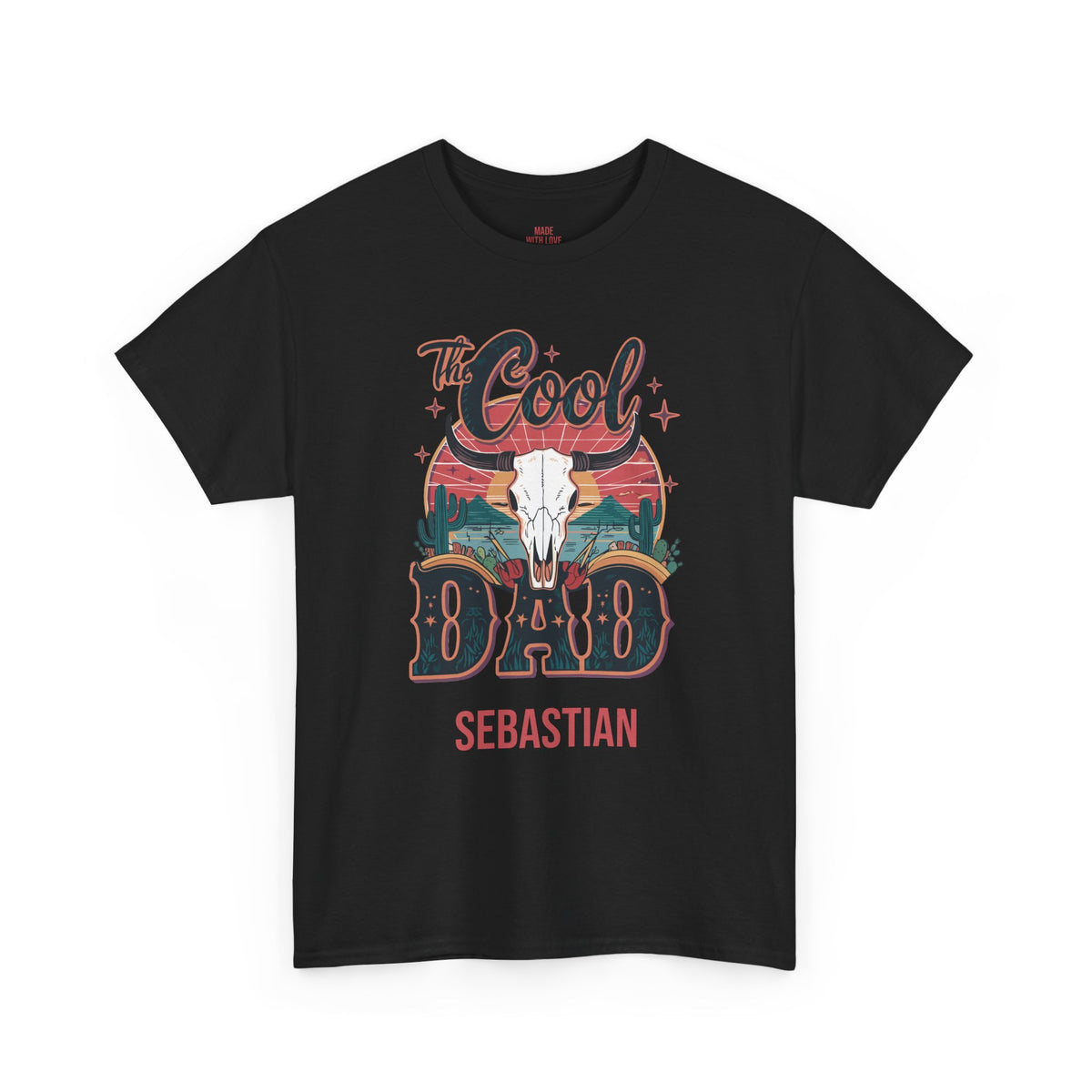A black short-sleeve crewneck t-shirt featuring a colorful graphic on the front with a skull, sunset stripes, and the text 'The Cool Dad Sebastian' in stylized lettering.