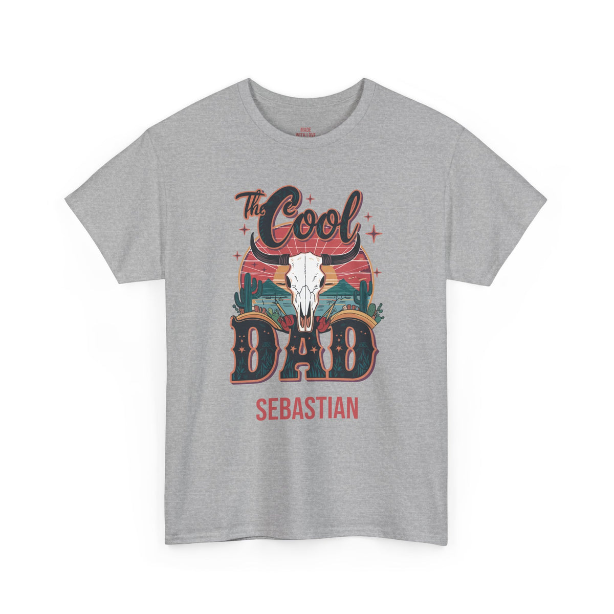A heather gray short-sleeve t-shirt with a graphic on the front that reads 'The Cool DAD SEBASTIAN' featuring a cowboy skull and sunset design, shown against a plain white background.