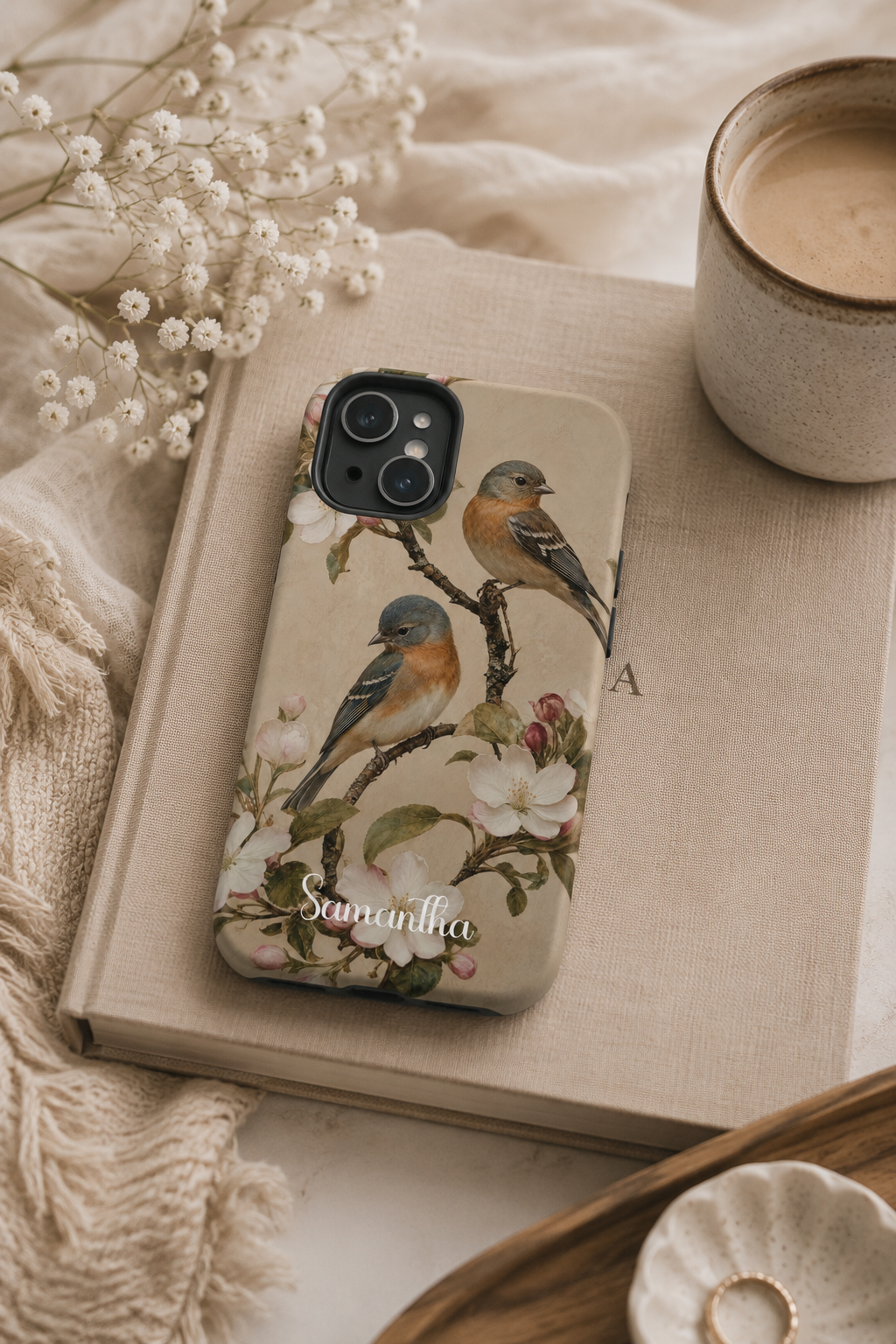 Vintage bird phone case shown in a lifestyle setting