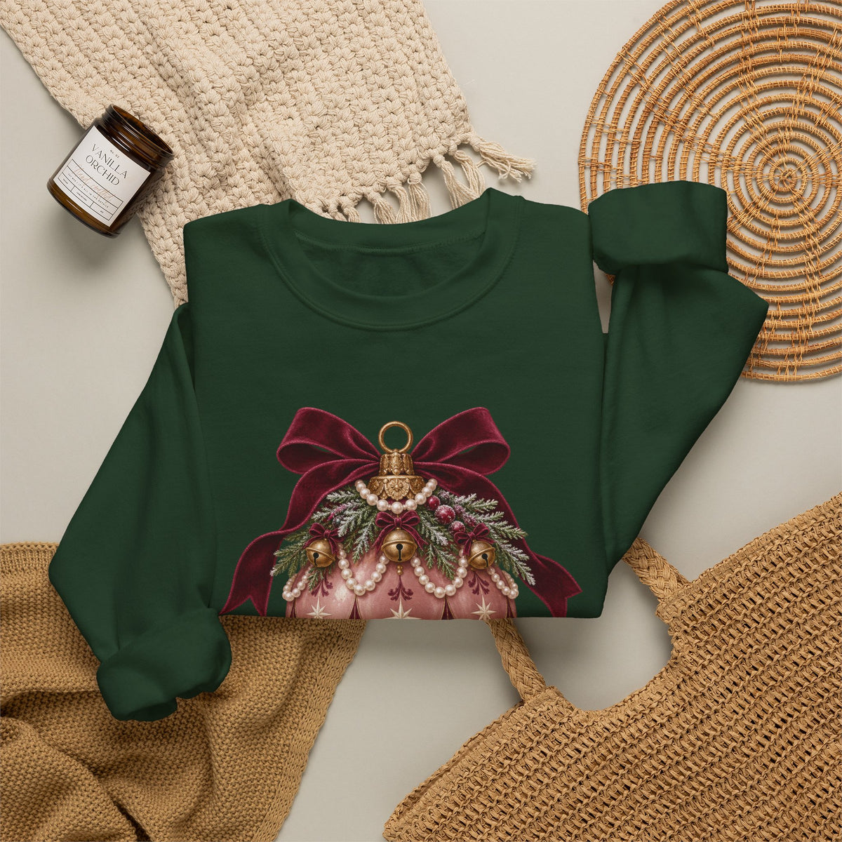 Forest Green personalized Pink Bauble Burgundy Bow sweatshirt, flat lay with cozy knit blanket