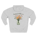 Heather grey personalized hoodie, back view, with “Raising Wildflowers” design