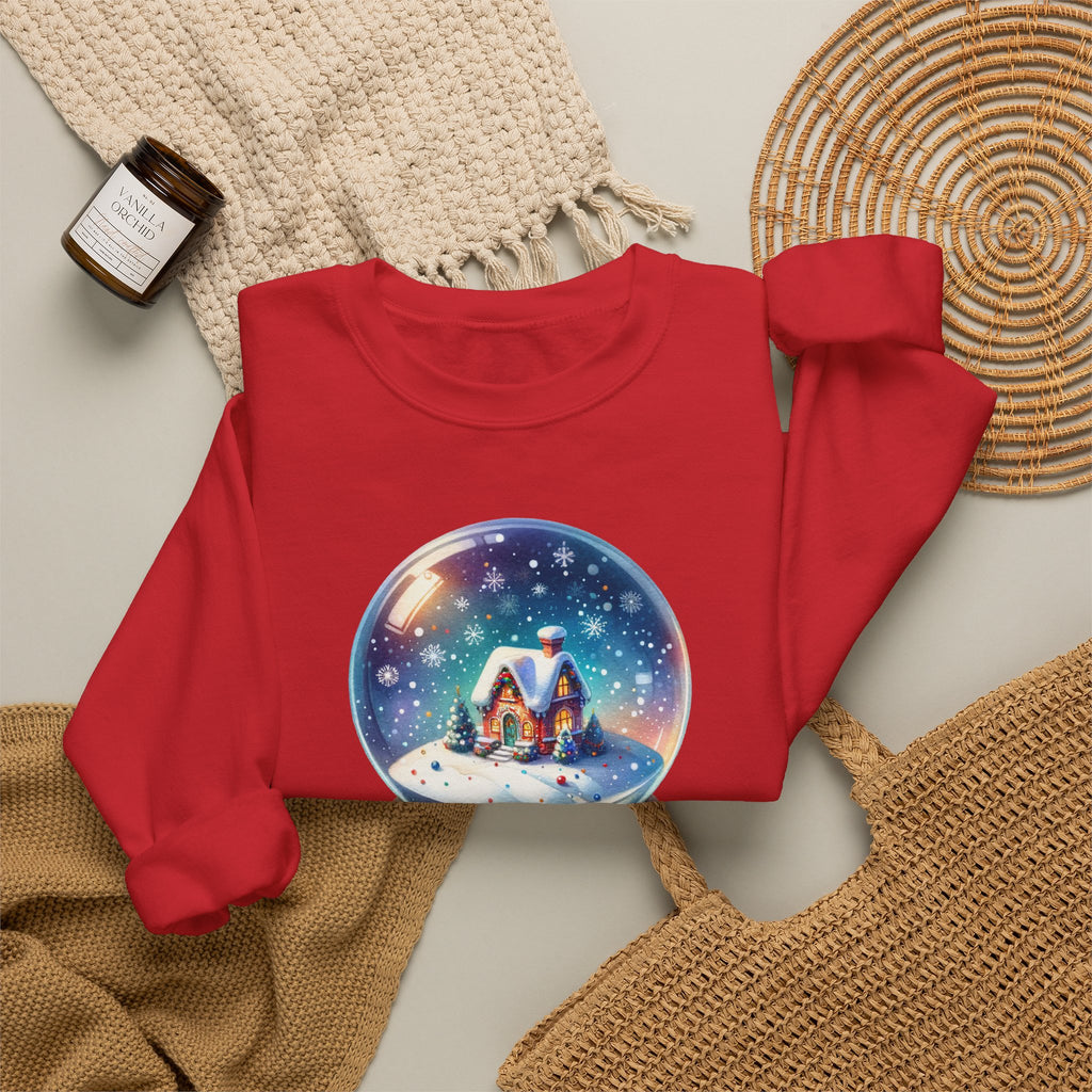 Red personalized Snow Globe sweatshirt, flat lay with cozy knit blanket