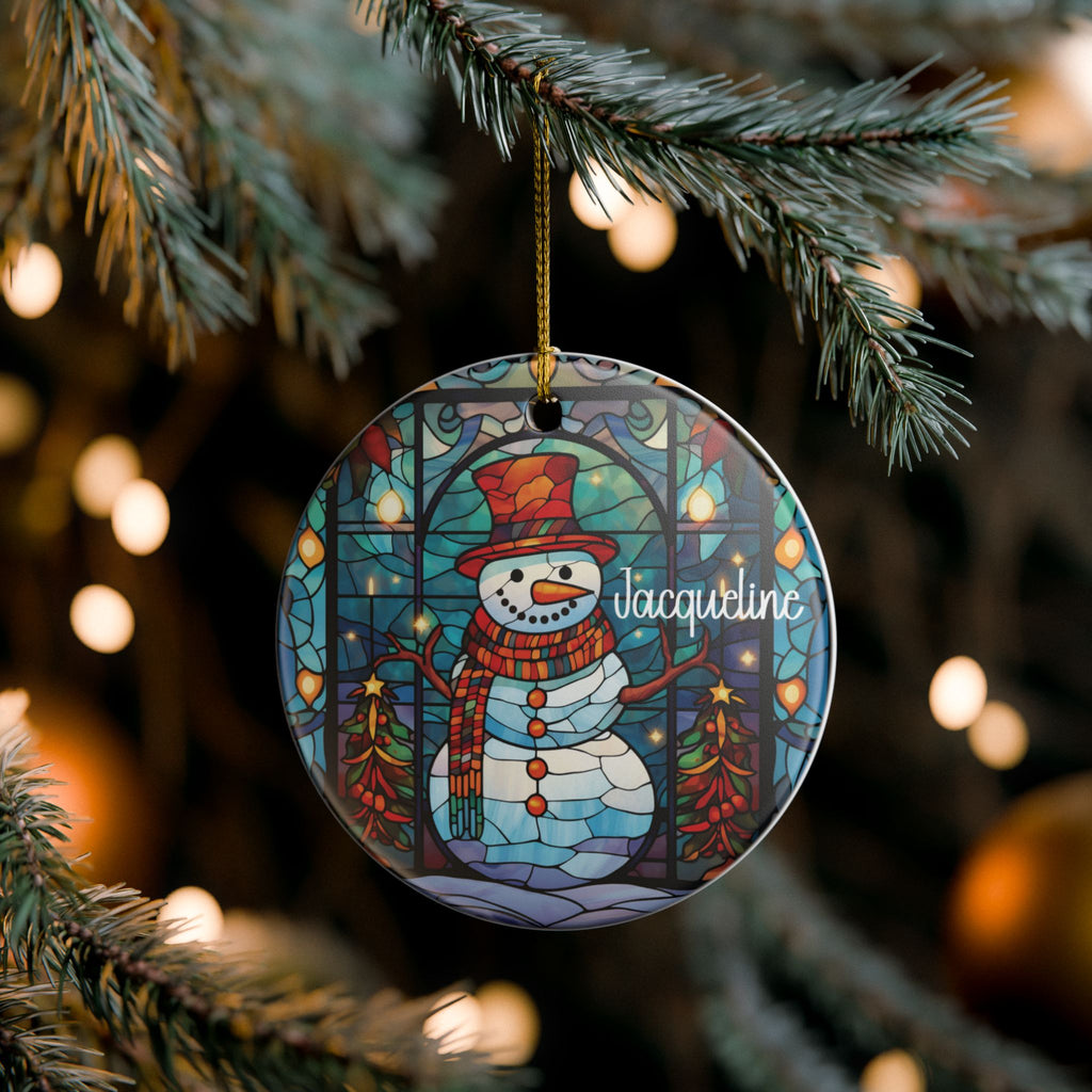 Stained Glass Snowman ornament hanging on a lit Christmas tree, lifestyle photo