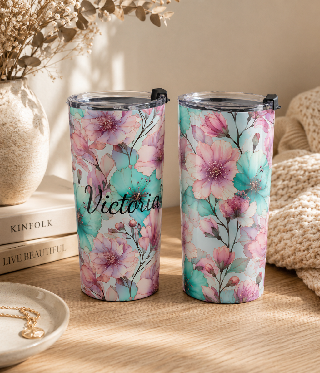 Pastel watercolor tumbler arranged in a decorative styled setting